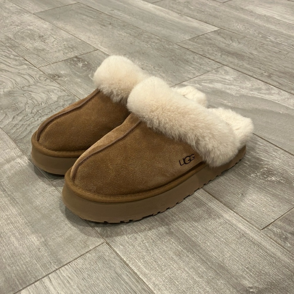 Woman’s platform UGGs, size eight, chestnut color, lightly worn.